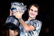 Roger Federer celebrating with the 2017 Australian Open men's singles trophy (Source: Getty)
